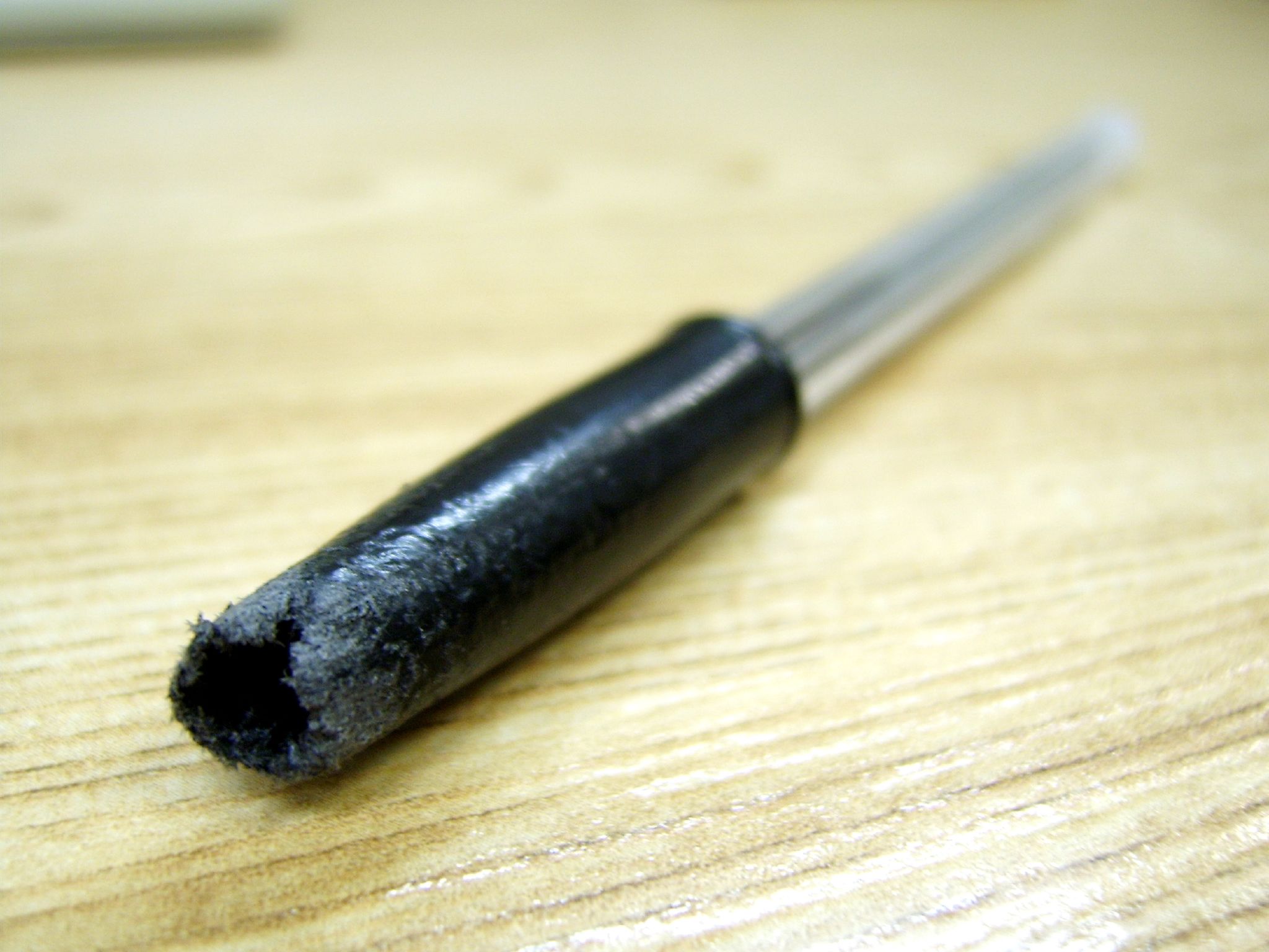 A pen chewed from anxious nibbling, representing the visible residue of task-start friction